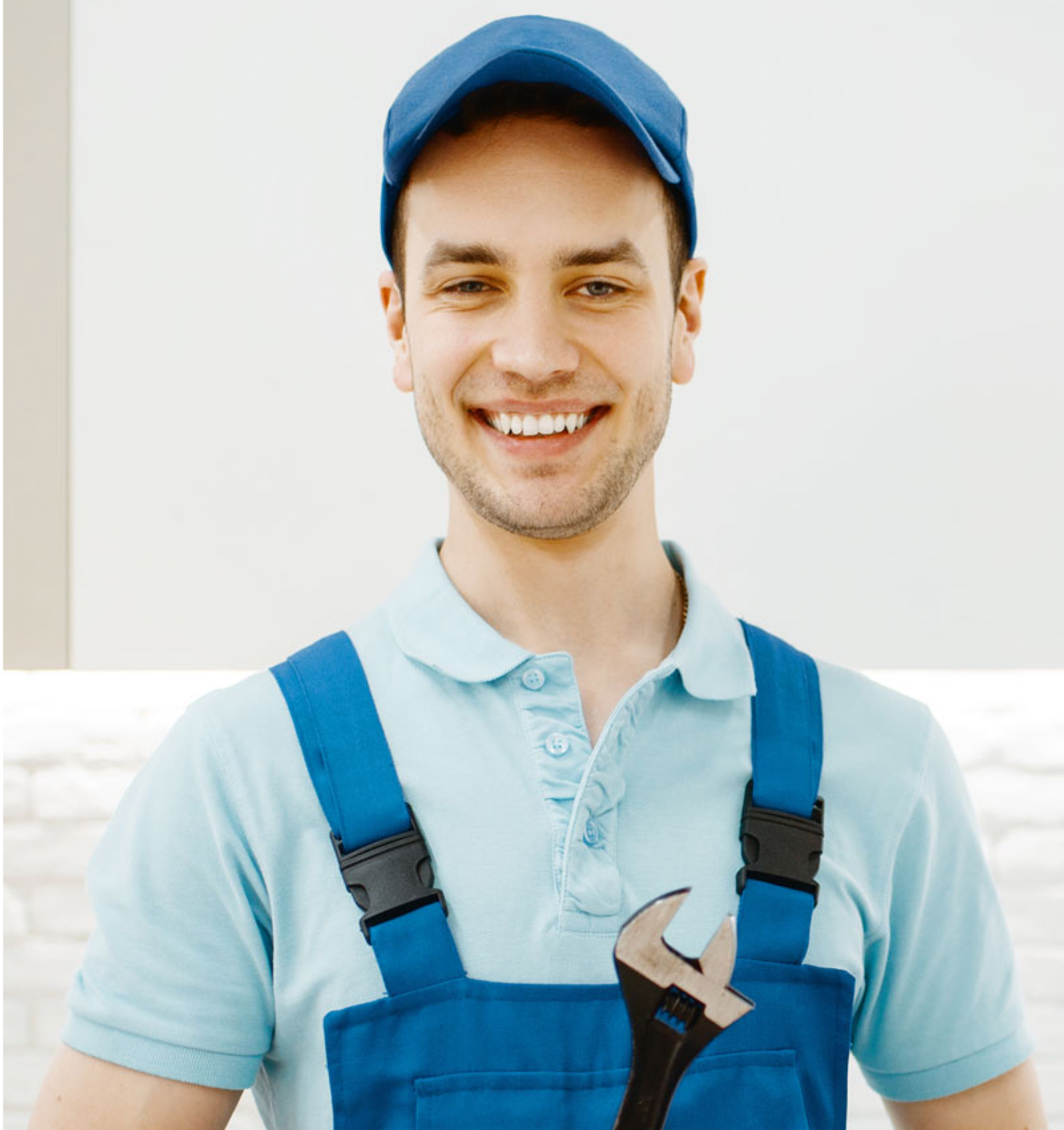 plumber in uniform fixing faucet in the kitchen 1